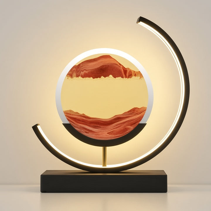 A modern LED arc lamp with a circular light box displaying a red and yellow landscape design, mounted on a black rectangular base.